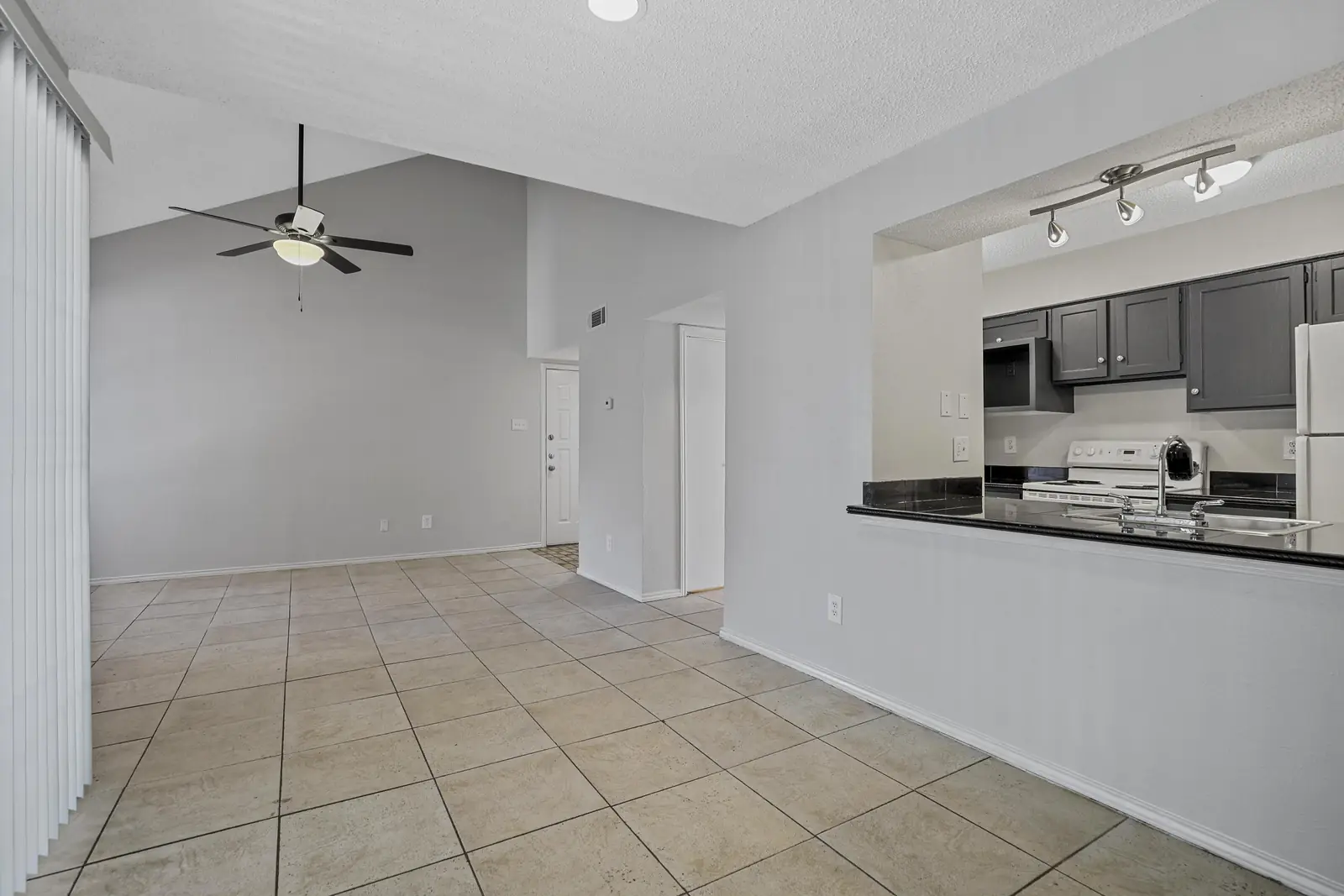 Living room opening onto the kitchen breakfast bar