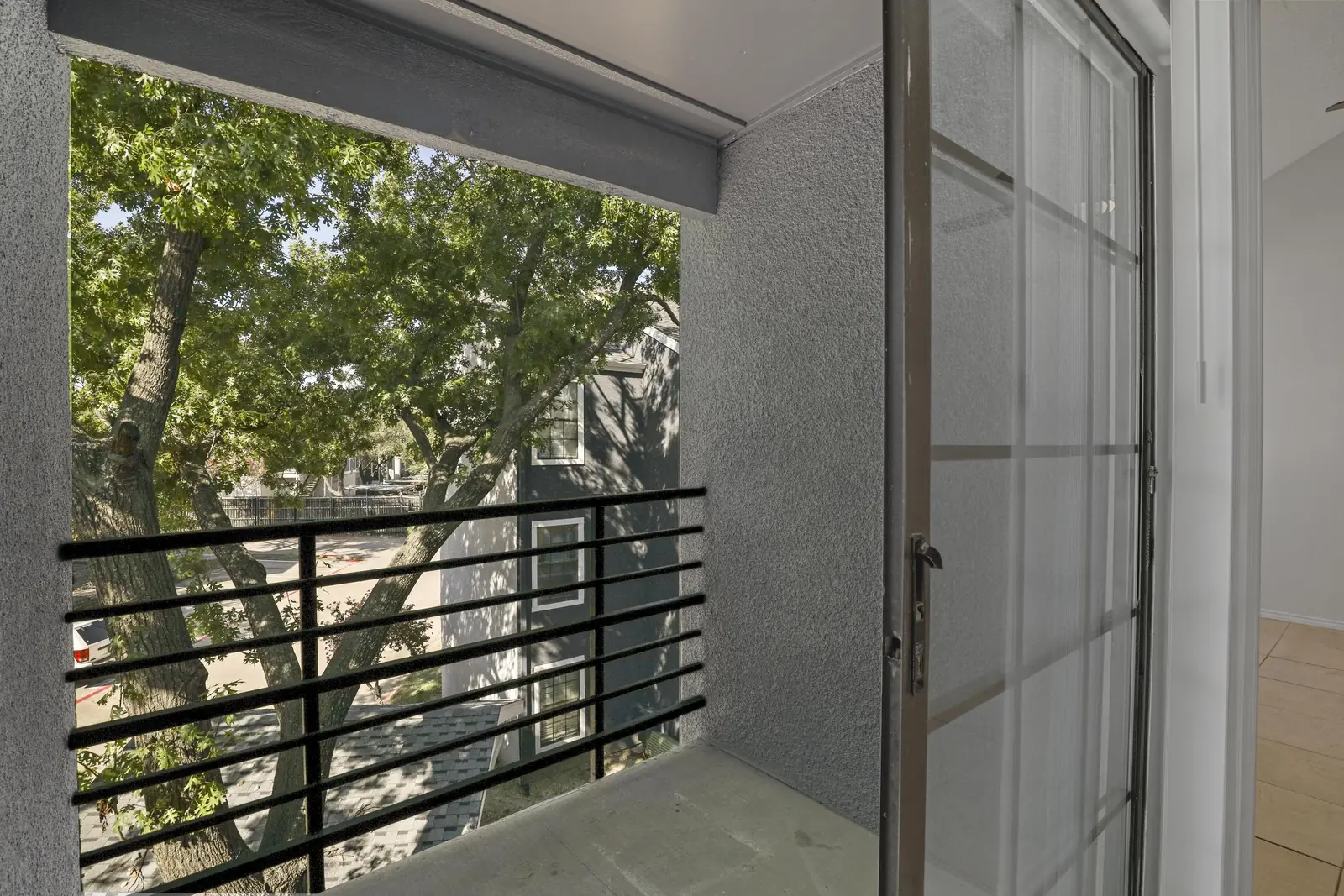 Private balcony overlooking mature trees