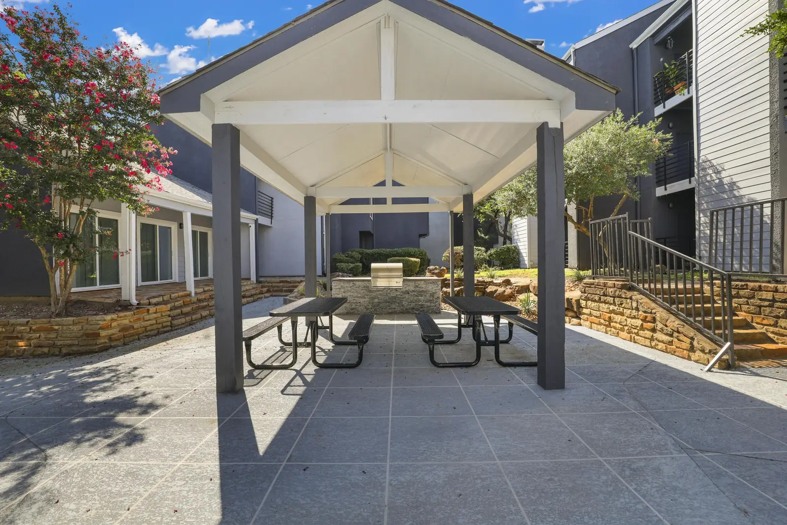 Shaded picnic and barbecue area at Village Oaks