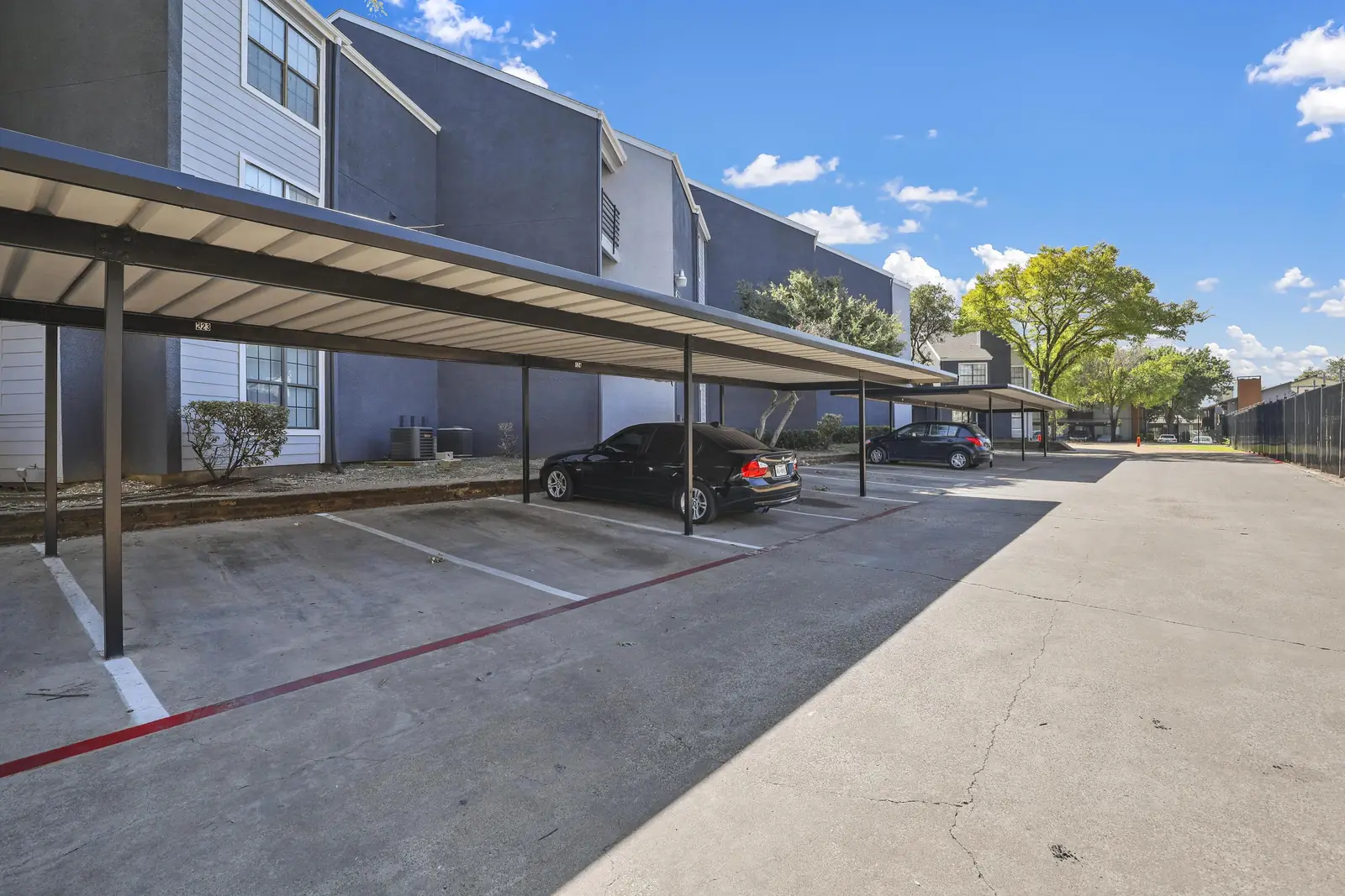 Row of covered carport parking for residents
