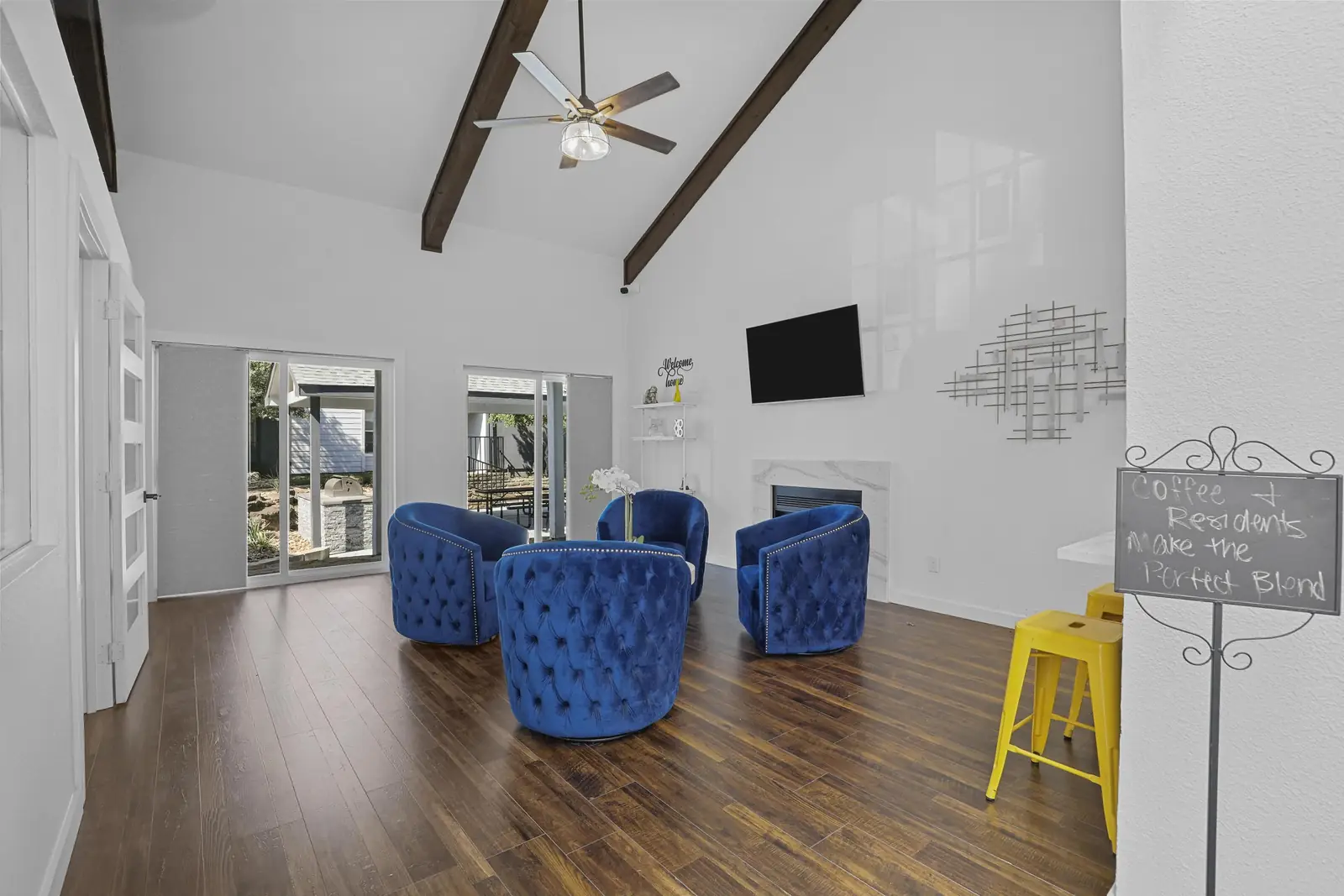 Resident lounge with seating and TV in the clubhouse