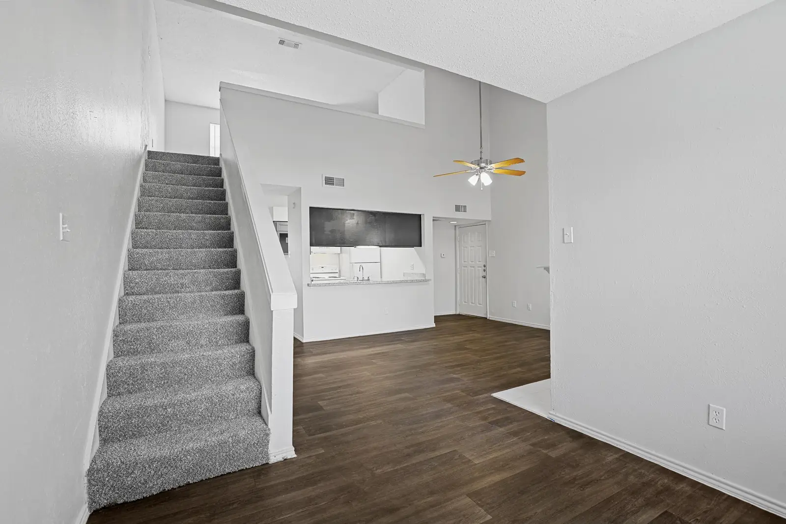 Carpeted staircase to the townhome upper level