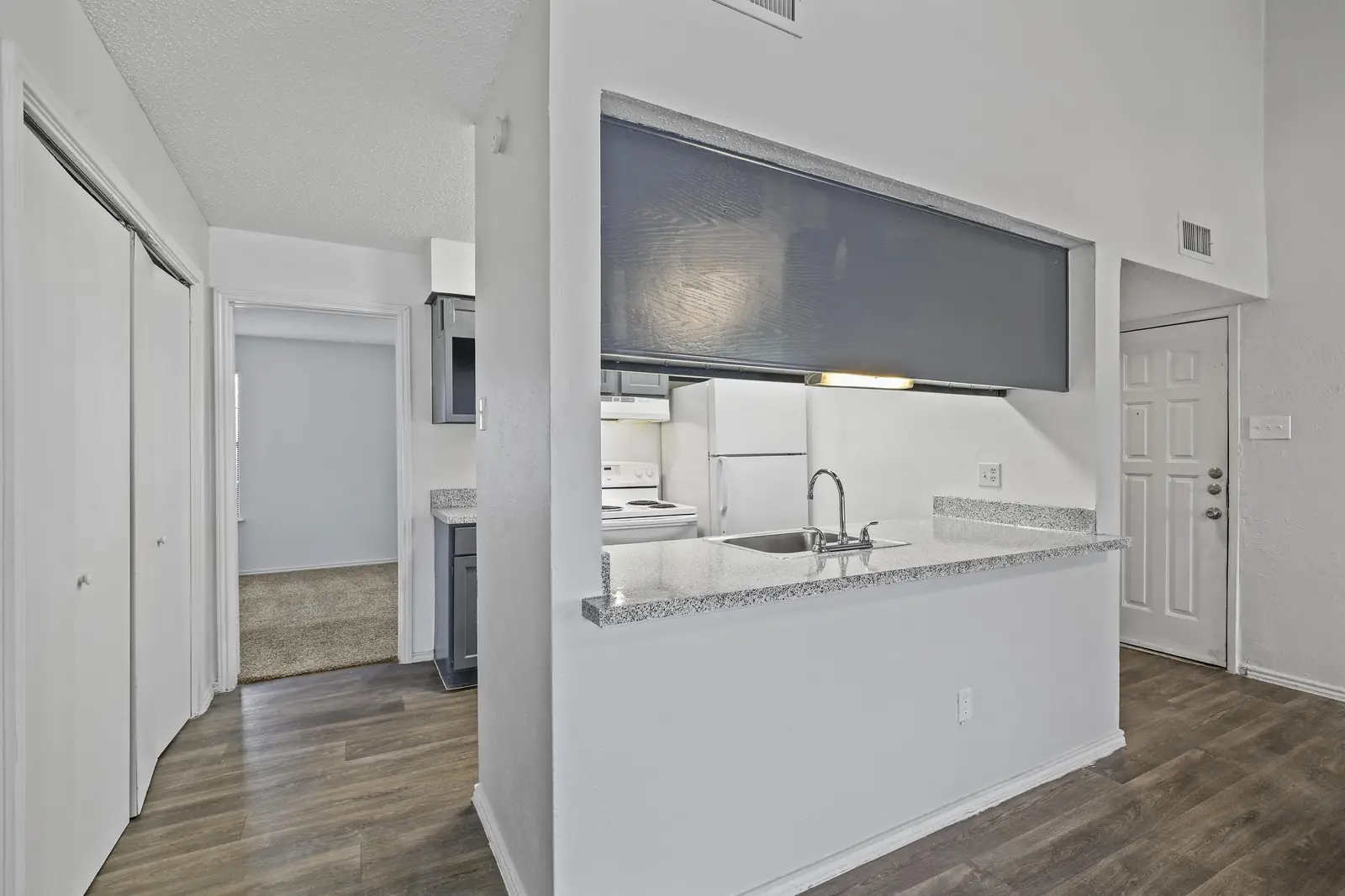 Kitchen pass-through bar off the townhome entry