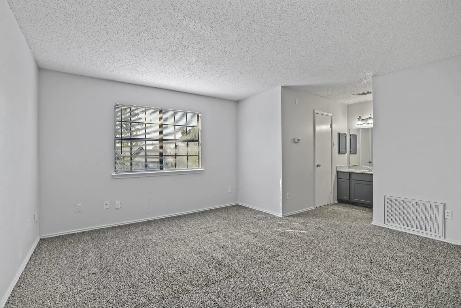 Upstairs bedroom with natural light and en-suite access